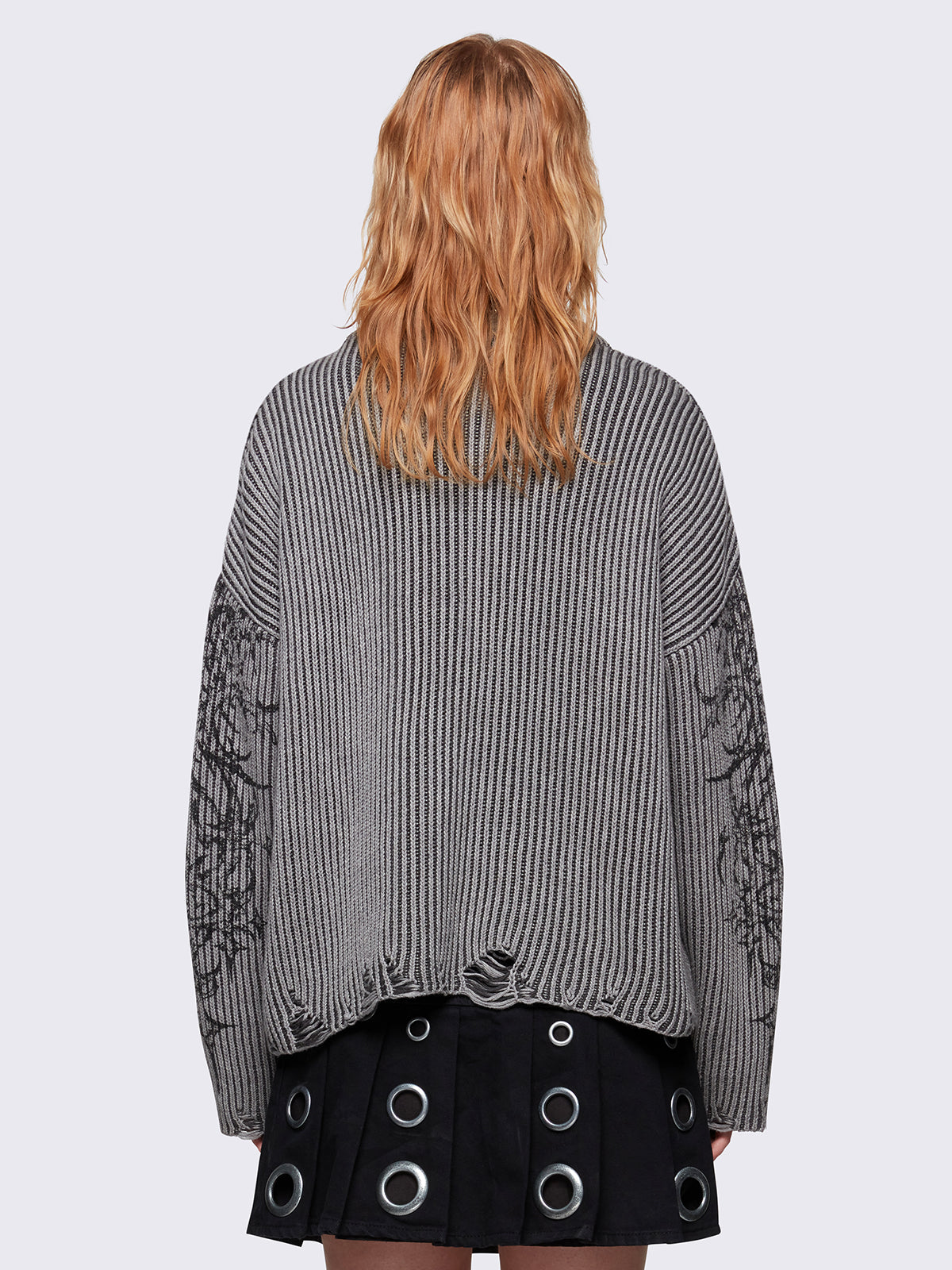 Grey marl knitted sweater with a bold tribal sigilism graphic print. Chunky ribbed knit with distressed details, perfect for grunge and Y2K alt fashion aesthetics.