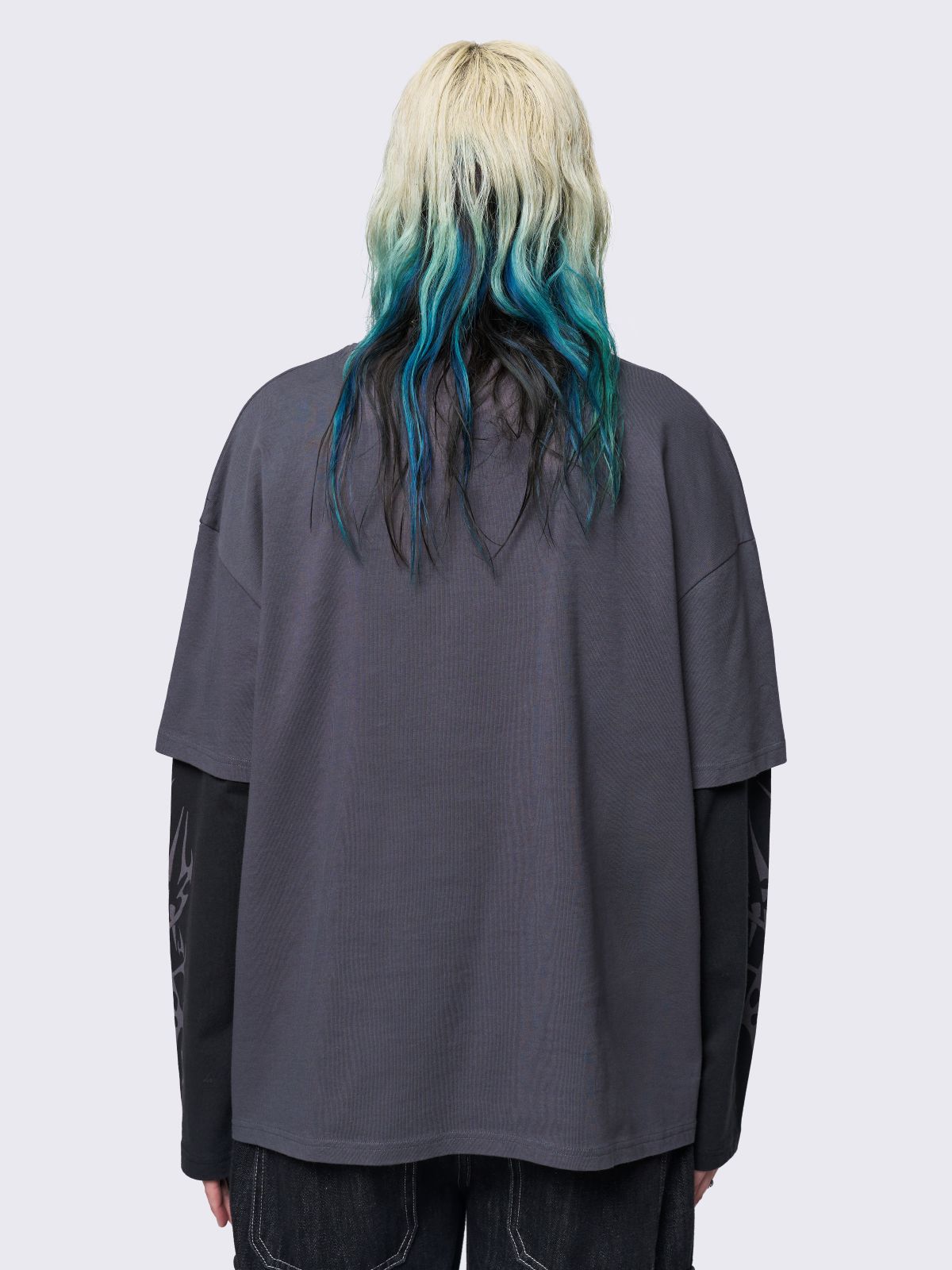 Layered long sleeve t-shirt in grey with contrast sleeves in black and sigilism graphic front and sleeves.