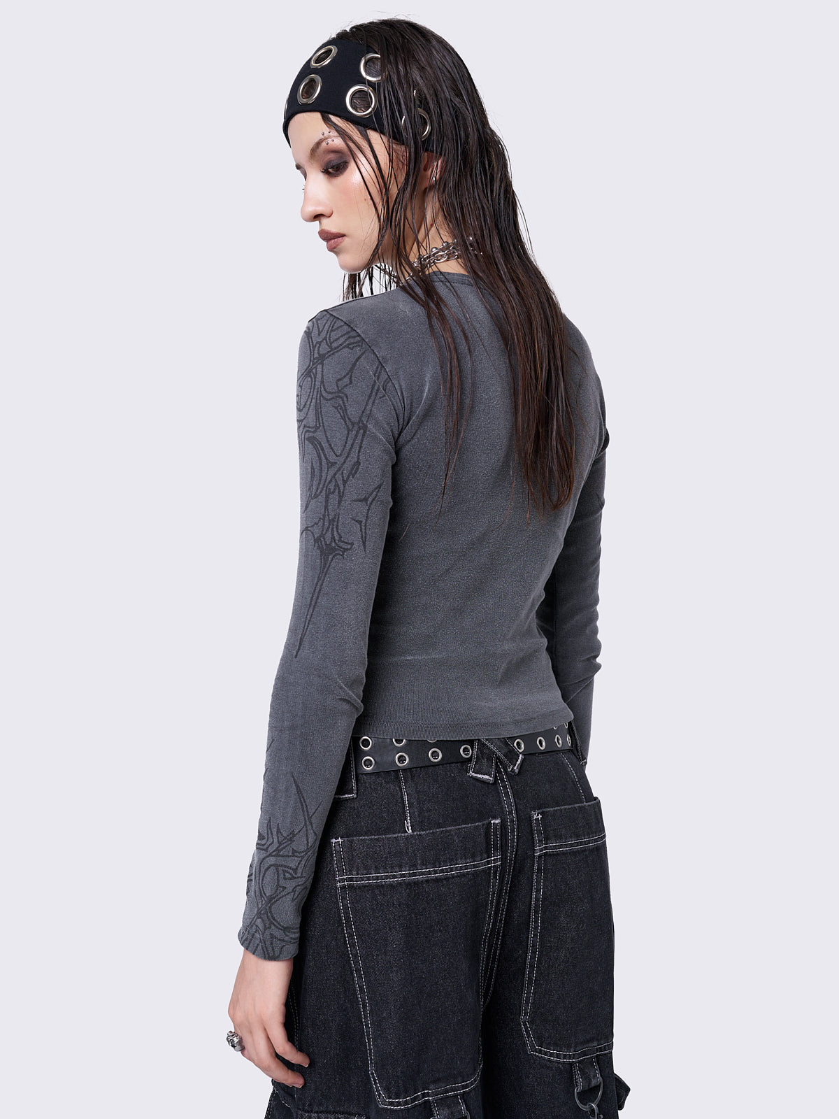 Grey washed long sleeve top with sigilism graphic front and sleeves print.