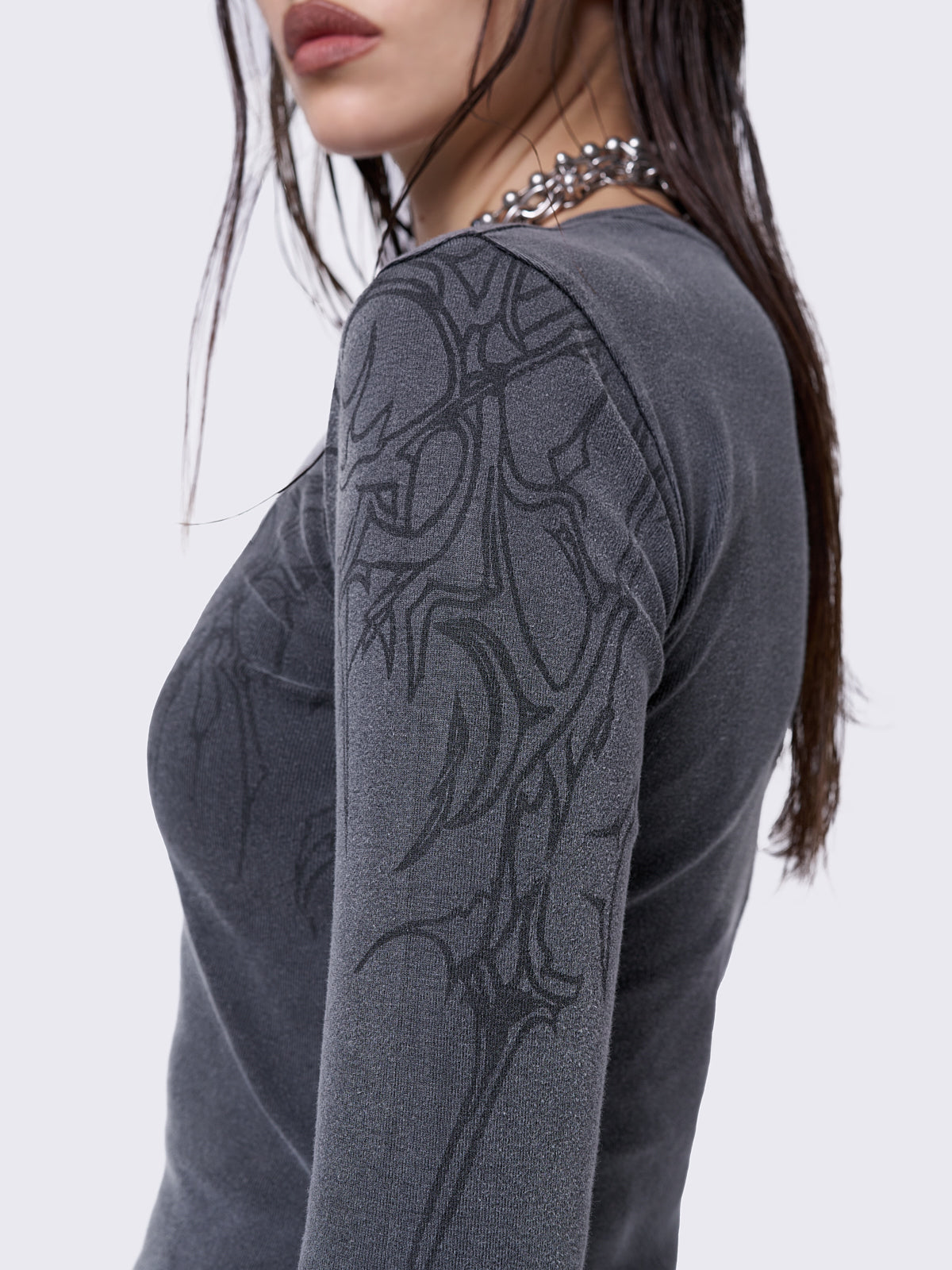 Grey washed long sleeve top with sigilism graphic front and sleeves print.